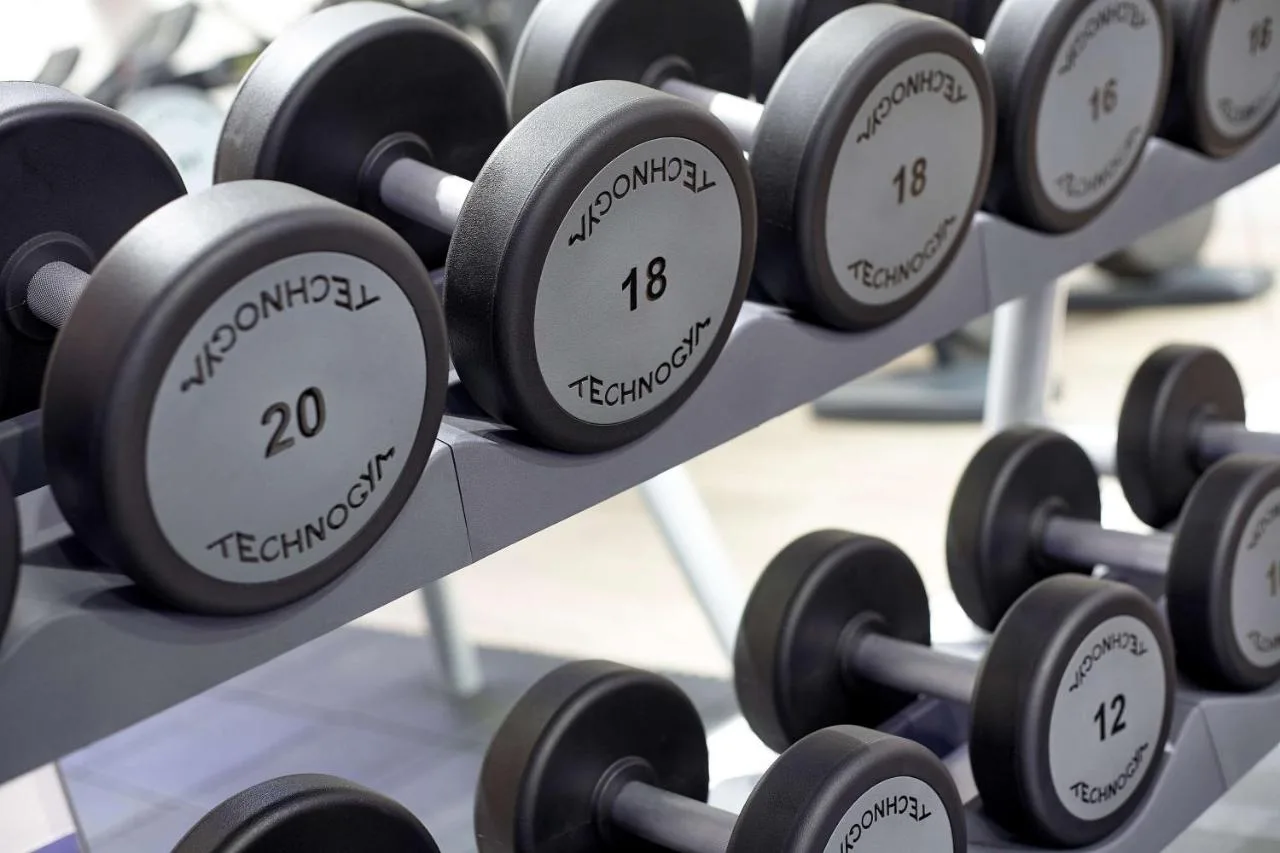 a bunch of dumbbells on display in a gym at Park Plaza London Victoria in London