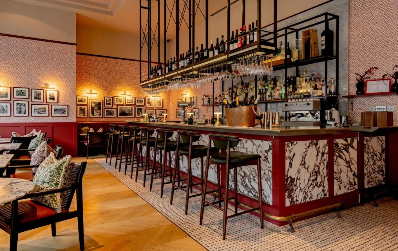 a bar with a row of bar stools at Park Plaza London Victoria in London